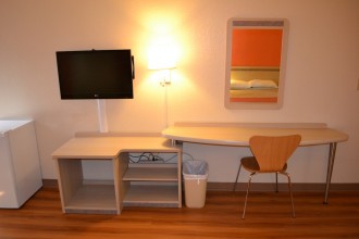 Flatscreen TV and Fridge with Desk